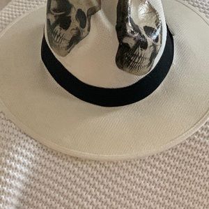 White straw hat with skulls